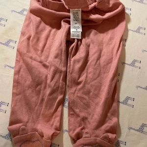 Pink baby pants with embroidered bear feet with ears